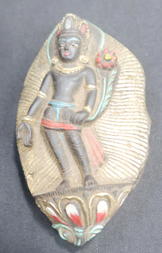 Standing Tara in carved fossil Standing Tara in carved fossil