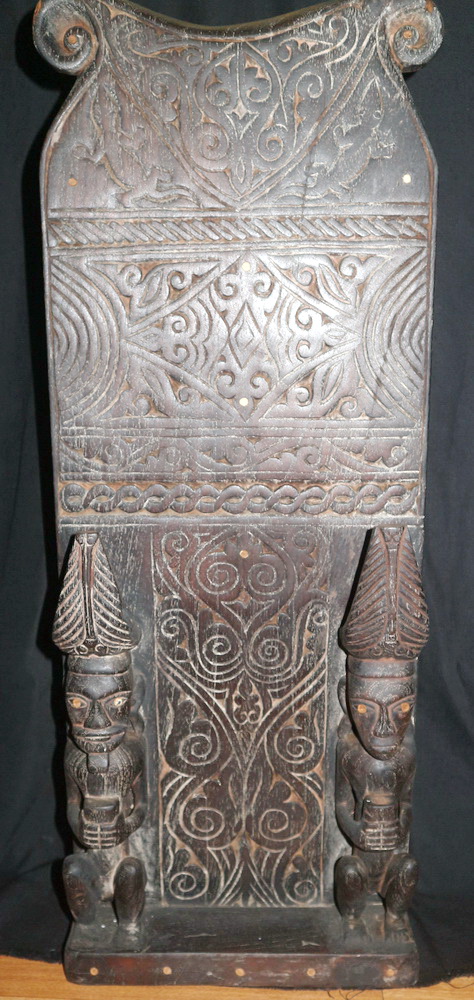 Sculpted panel of ancestral figures Sculpted panel of ancestral figures