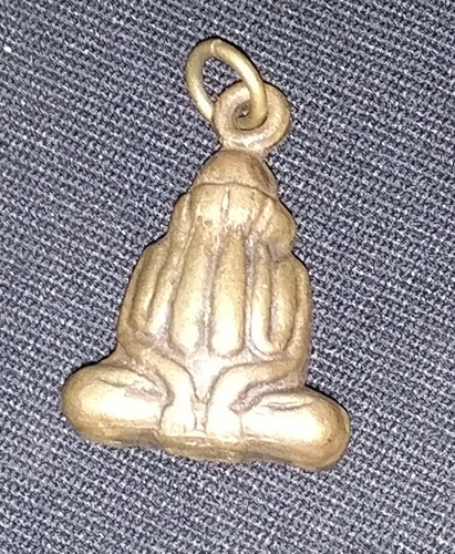 Closed eyes Buddha amulet