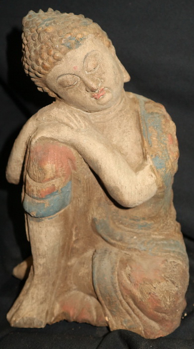 Chinese Buddha sitting in a strange posture