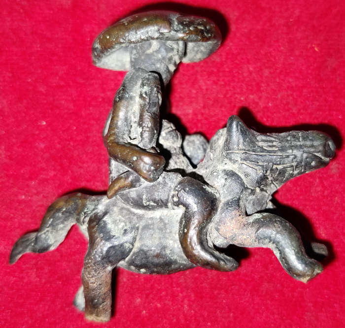 Old farmer on animal. Folk art